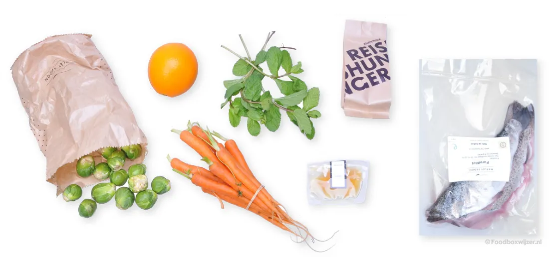 De ingredienten voor het eerste gerecht, spruitjes, wortels en forelfilet