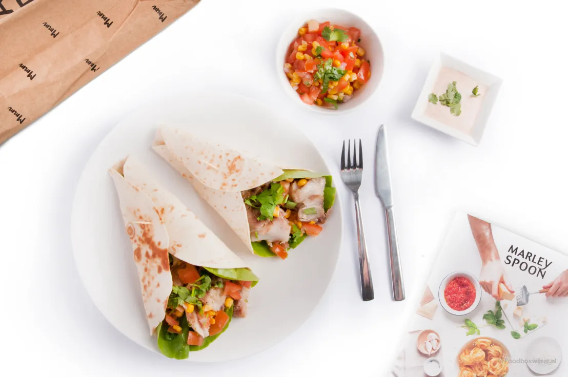Een mooi resultaat op tafel de wraps met koolvis en maissalsa