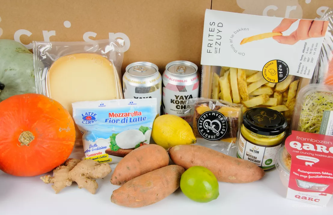 In de app van crisp kan je een groot assortiment boodschappen bestellen zoals deze producten als pompoen, groentenkiemen, mosterd, kaas en fruit